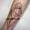 patricia_noirdejais_noir-de-jais_tattoo-on-move_fine-line-tattoo_iris_visage_geometrique_original